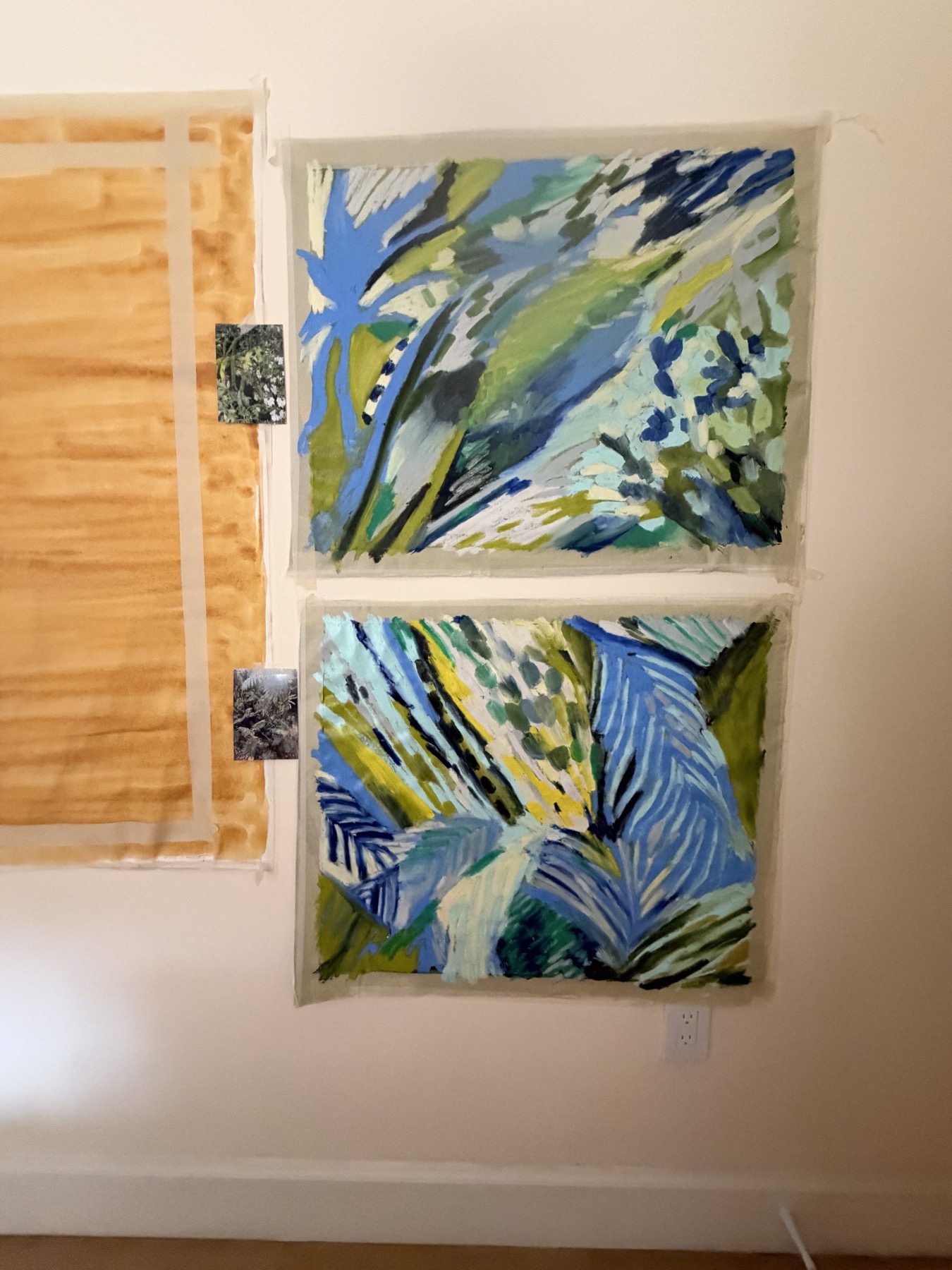 Morning Walk paintings with their reference photographs in the studio